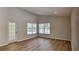 Bright living room with wood floors, neutral colors, and ample natural light at 6805 Winslow St, Sarasota, FL 34243