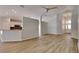 Open-concept living area with wood floors, neutral colors and lots of light at 6805 Winslow St, Sarasota, FL 34243