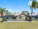 The screened-in pool offers a private backyard oasis at 8640 Chadwick Dr, Tampa, FL 33635
