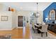 Spacious dining area features hardwood floors, elegant light fixture, and decorative accents at 8640 Chadwick Dr, Tampa, FL 33635