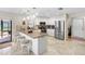 Modern kitchen features stainless steel appliances, breakfast bar, and ample counter space at 8640 Chadwick Dr, Tampa, FL 33635