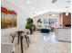 Open concept living room boasts a brick fireplace and vaulted ceilings at 8640 Chadwick Dr, Tampa, FL 33635