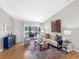Cozy living room with view of pool, features stylish furniture, decor, and hardwood floors at 8640 Chadwick Dr, Tampa, FL 33635