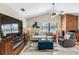 Inviting living room featuring a brick fireplace, TV, and comfortable seating at 8640 Chadwick Dr, Tampa, FL 33635