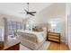 Main bedroom featuring vaulted ceilings, a ceiling fan and sliding glass doors at 8640 Chadwick Dr, Tampa, FL 33635