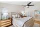 Serene main bedroom with wood floors, a ceiling fan, and an ensuite bath at 8640 Chadwick Dr, Tampa, FL 33635