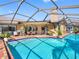 Relax in the pool or on the patio in this stunning outdoor living space at 8640 Chadwick Dr, Tampa, FL 33635
