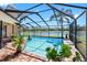 Beautiful screened-in pool with scenic lake views at 8640 Chadwick Dr, Tampa, FL 33635