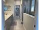 Elegant bathroom with double vanity, sleek cabinets, and modern walk-in glass shower at 953 Crosswind Ave, Sarasota, FL 34240