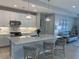 Modern kitchen with a center island, pendant lighting, and stainless steel appliances at 953 Crosswind Ave, Sarasota, FL 34240