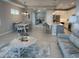 Bright, open-concept living room features stylish decor, modern finishes, and lots of natural light at 953 Crosswind Ave, Sarasota, FL 34240