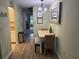 View of dining area leading to the living room and kitchen, featuring modern flooring at 11201 80Th Ave # 305, Seminole, FL 33772