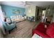 Open concept living area showcasing beach-inspired decor and view into the dining area at 11201 80Th Ave # 305, Seminole, FL 33772