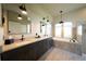 Bathroom featuring double sinks, a soaking tub, and modern fixtures at 12117 Clear Harbor Dr, Tampa, FL 33626