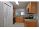 Kitchen with stainless steel microwave, wooden cabinets and granite countertops at 13736 Orange Sunset Dr, Tampa, FL 33618