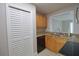 Kitchen featuring wooden cabinets, granite countertops and stainless steel sink at 13736 Orange Sunset Dr, Tampa, FL 33618