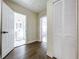 Hallway leading to bathroom, bedroom, and closet with modern hardwood floors at 1403 E Laura St, Plant City, FL 33563