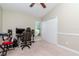 Bedroom with neutral walls, carpet flooring, vaulted ceiling with fan, and a closet with double doors at 14501 Brambie Ct, Tampa, FL 33624