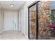 Entryway with tile flooring, natural light from courtyard window, and closet at 14501 Brambie Ct, Tampa, FL 33624