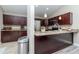 Kitchen featuring rich wood cabinets, stainless steel appliances, and granite countertops at 14501 Brambie Ct, Tampa, FL 33624