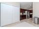 View of the kitchen showing ample cabinet space and stainless steel appliances next to the pantry at 14501 Brambie Ct, Tampa, FL 33624