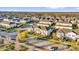 Aerial view of a well-maintained community featuring modern townhomes and lush landscaping at 14925 Promenade Pkwy, Odessa, FL 33556