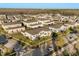 An aerial view showcases townhome-style condos with well-maintained landscaping, and easy street access for residents at 14925 Promenade Pkwy, Odessa, FL 33556