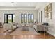 Cozy community room with comfortable seating, lots of light, and neutral color palette at 14925 Promenade Pkwy, Odessa, FL 33556