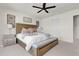 Cozy main bedroom with ceiling fan, neutral tones, and comfortable furnishings at 14925 Promenade Pkwy, Odessa, FL 33556