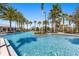 Resort style pool surrounded by palm trees at 14925 Promenade Pkwy, Odessa, FL 33556