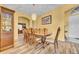 Dining room features wood flooring, modern light fixture, and traditional dining set at 1602 Brilliant Cut Way, Valrico, FL 33594