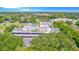 An aerial shot showcases the community's layout, surrounded by trees, parking, and a pool at 1655 S Highland Ave # G164, Clearwater, FL 33756