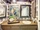 Stylish bathroom with unique wallpaper, decor and vanity with sink at 1655 S Highland Ave # G164, Clearwater, FL 33756