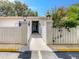 Inviting walkway with decorative fence leading to unit entrance at 1655 S Highland Ave # G164, Clearwater, FL 33756