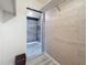 Hallway leading to a storage closet, offering additional storage space and a glimpse of the home's layout at 1655 S Highland Ave # G164, Clearwater, FL 33756