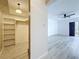 Hallway leading to a bright living room and a storage closet, offering a glimpse of the home's spacious layout at 1655 S Highland Ave # G164, Clearwater, FL 33756