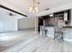 Open-concept kitchen showcases a breakfast bar, modern lighting, and a seamless flow to the living area at 1655 S Highland Ave # G164, Clearwater, FL 33756