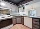 Well-lit kitchen featuring updated appliances, tiled backsplash, and lots of counter space at 1655 S Highland Ave # G164, Clearwater, FL 33756
