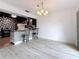 Bright kitchen displays bar seating, stylish backsplash, and an adjacent dining area at 1655 S Highland Ave # G164, Clearwater, FL 33756