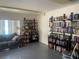 Inviting library space with floor-to-ceiling bookshelves, gray couch and great lighting at 1655 S Highland Ave # G164, Clearwater, FL 33756