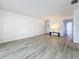 Inviting living room boasts light-colored wood floors, neutral paint, and ample natural light at 1655 S Highland Ave # G164, Clearwater, FL 33756