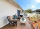 Outdoor patio with seating and beautifully landscaped garden area at 1655 S Highland Ave # G164, Clearwater, FL 33756