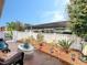 Relaxing outdoor patio with well-manicured landscaping and covered parking view at 1655 S Highland Ave # G164, Clearwater, FL 33756
