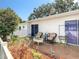 Charming patio features outdoor seating and lush landscaping at 1655 S Highland Ave # G164, Clearwater, FL 33756