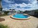 Large, uniquely shaped, community swimming pool with plenty of seating for residents to enjoy at 1655 S Highland Ave # G164, Clearwater, FL 33756