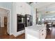 Modern kitchen features stainless steel appliances, white cabinetry, and granite countertops at 16573 Hutchison Rd, Odessa, FL 33556
