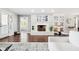 Inviting living room featuring a white brick fireplace and stylish built-in shelving at 16573 Hutchison Rd, Odessa, FL 33556