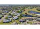 Aerial view of a Florida community with ponds, walking paths, and manicured landscaping at 206 Glenellen Pl, Sun City Center, FL 33573