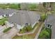 Aerial view of the home featuring lush landscaping and a well-maintained roof at 2129 Acadia Greens Dr, Sun City Center, FL 33573