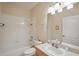 Bright bathroom featuring a shower-tub combo and a modern vanity at 2129 Acadia Greens Dr, Sun City Center, FL 33573